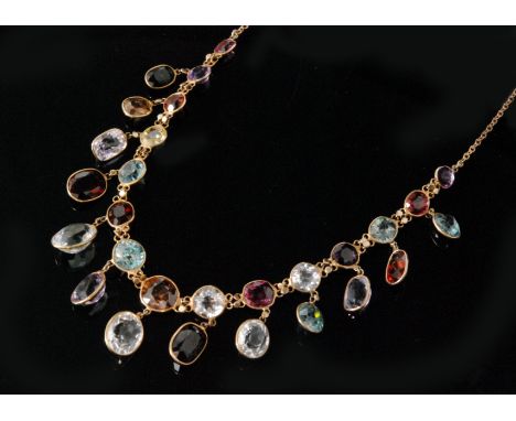 A multi-coloured gem stone fringe necklace, designed as a chain of graduated spectacle set oval and round cut stones to inclu