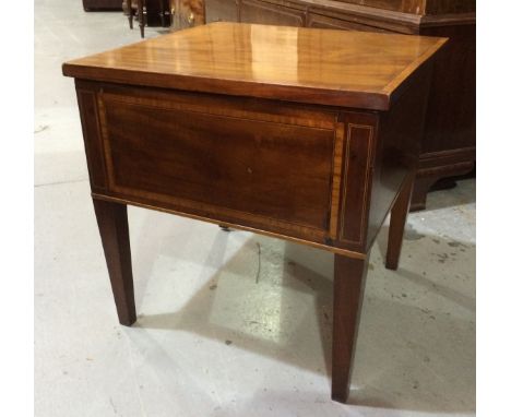A late Regency mahogany commode of square section with lift lid to fully fitted interior above a panel front and tapered squa