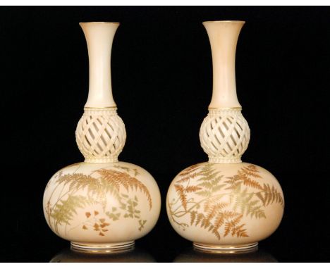 A pair of 19th Century Royal Worcester vases, each of globe and shape form with a reticulated knop, the bodies decorated with