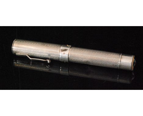 A George VI hallmarked silver pen torch, the cylindrical case with engine turned decoration, monogrammed to cap ED, length 13