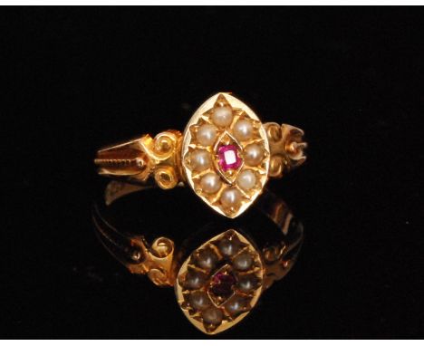 A 19th Century 15ct seed pearl and ruby ring, central ruby within eight split pearl surround all to a marquise shaped head an