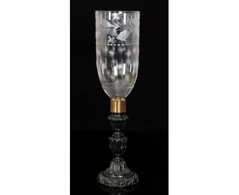 A late 19th Century Anglo Indian carved ebony storm lamp together with glass shade with cut star burst and leaf decoration, h