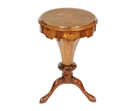 A Victorian walnut work table, the hinged circular top inlaid with a study of St George slaying the dragon, enclosing a fitte