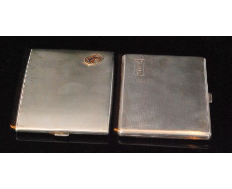 Two early 20th Century hallmarked silver rectangular cigarette cases each with engine turned decoration detailed with initial