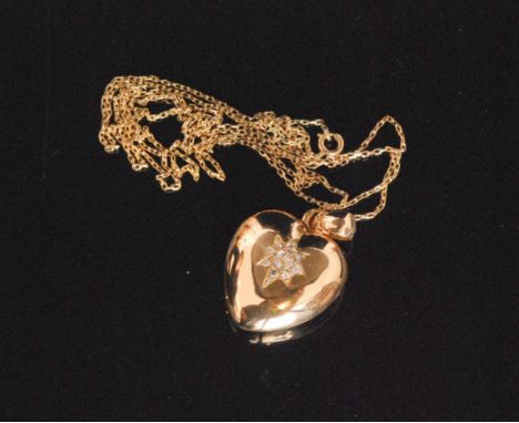 A French 9ct and diamond heart shaped pendant locket, the rose gold locket with diamond set central star, all to fine trace l