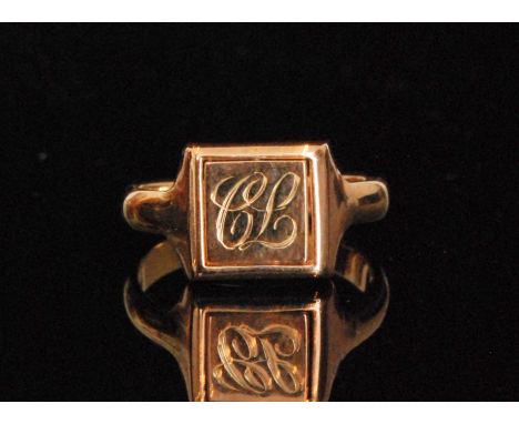 A mid 20th Century Masonic swivel signet ring, with compass and set square to a blue enamel ground and initials to the other 