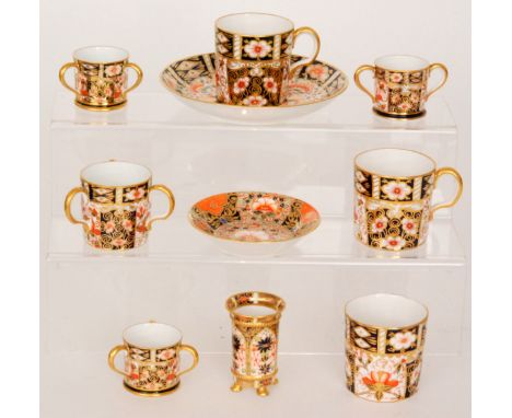 A small collection of assorted early 20th Century Royal Crown Derby to include coffee cans, two saucers, four tygs and a posy