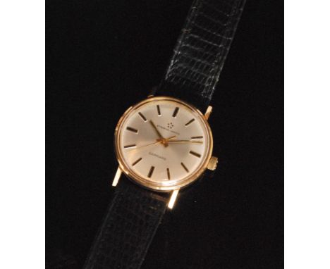 A 1960s 9ct Garrard Eternamatic gentleman's manual wind wrist watch with circular silvered dial and applied gilt and black ba