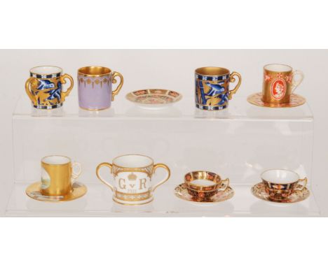 A collection of assorted miniature cabinet pieces comprising two Coalport cups and saucers, two Royal Crown Derby Imari patte