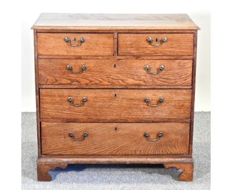 A George III oak and ash chest, on bracket feet, 95cm