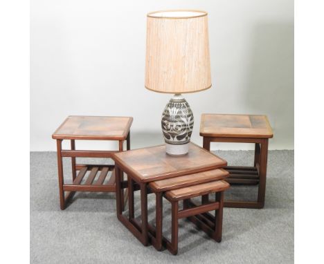 A 1970's hardwood nest of three occasional tables, with tiled tops, together with a pair of matching side tables and a potter