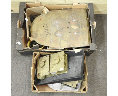 Two boxes of various clock parts