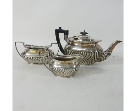A Victorian silver three piece tea service, with half gadrooned body, Sheffield 1898