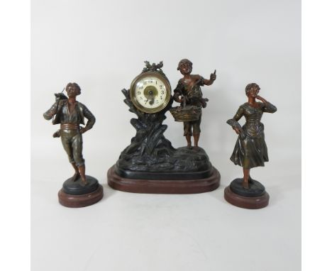 A 19th century French spelter figural clock garniture, 32cm high