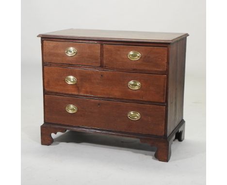 A George III oak chest of drawers, on bracket feet, 93cm