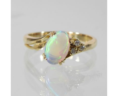 An unmarked bespoke made opal and diamond cluster ring