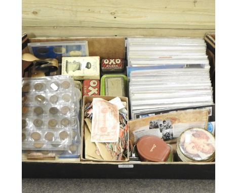 A collection of coins, stamps and first day covers