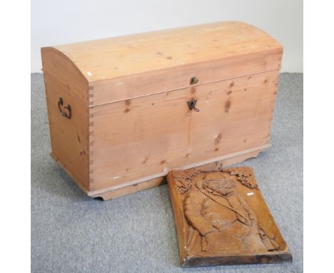 An antique pine dome top trunk, 100cm, together with a continental wood carving panel