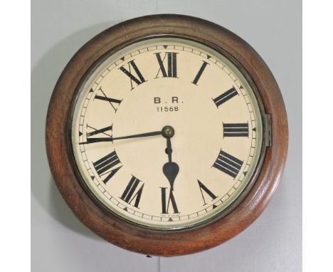 A 19th century oak cased dial clock, the dial inscribed 'BR' for British Railway, 38cm diameter