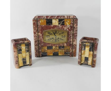 An Art Deco rouge marble three piece clock garniture, 30cm high