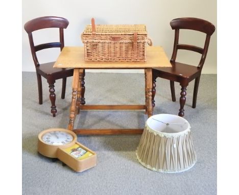 A pair of Regency style hardwood dining chairs, together with a 20th century oak side table, an advertising wall clock and a 