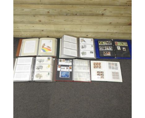 A collection of stamp albums and first day covers