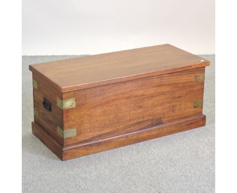 An iroko hardwood trunk, 100cm