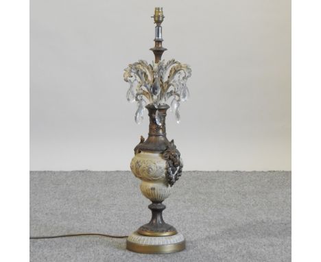 An ornate gilt and painted table lamp, 77cm high