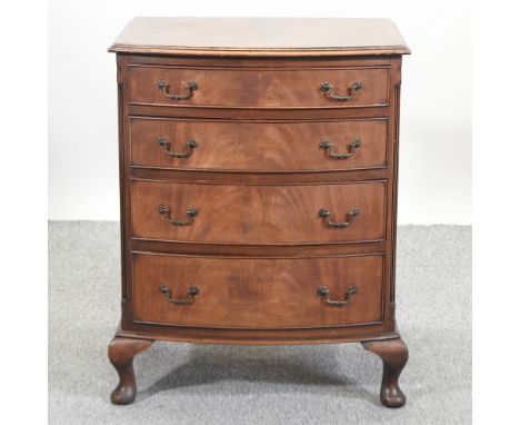 A 1920's walnut bow front chest, containing four drawers, 61cm