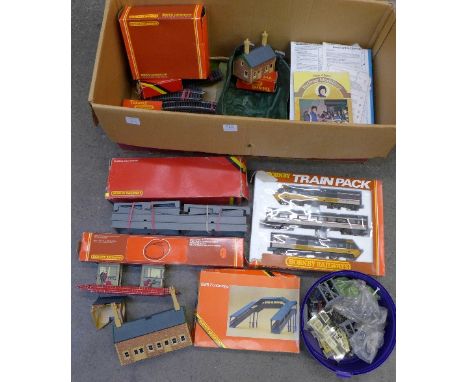 Hornby 00 gauge model rail, including track, buildings, a Brimtoy platform, five wagons, a tub of trackside accessories and a