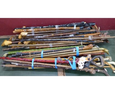A collection of fifty-eight walking sticks, including an ice-axe