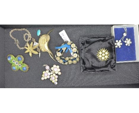 A silver bracelet, seven brooches, one lacking pin, a stick pin and forty-four Victorian buttons