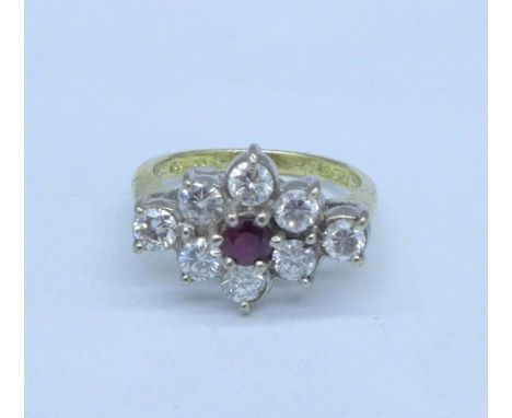 An 18ct gold, ruby and diamond cluster ring, approximately 1.2 carat diamond weight, London 1997, size M, 5g