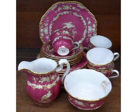 A Spode tea service comprising five cups, six saucers, six medium plates, plate, cream and sugar, (20)