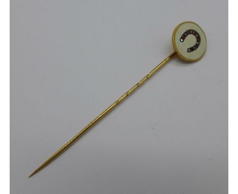 A yellow metal, enamel, ruby and diamond stick pin with continental control marks