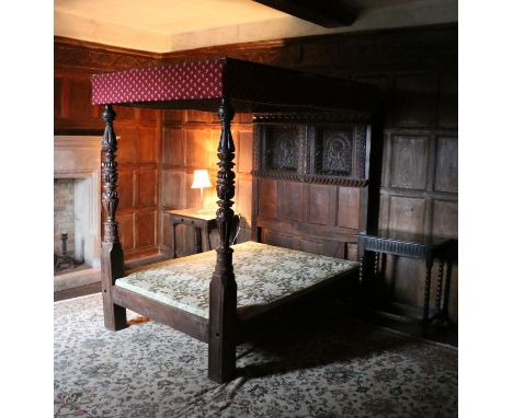 A rare Elizabeth I oak tester bed, circa 1580Having a twelve-panelled tester, each panel carved with a flowerhead-filled loze