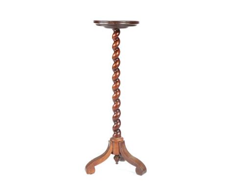 A late 17th century walnut candlestand, circa 1690 and laterHaving a circular dished top, on a spiral turned pillar with fini