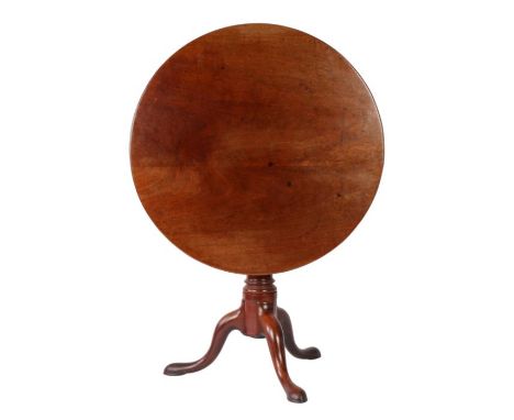 A George II 'red walnut' tilt-top tripod table, circa 1750

The large circular top formed from two wide boards, on a cage-blo