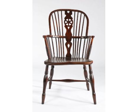 A 19th century ash and elm high-back Windsor armchair, English, circa 1830The hooped back with wheel-pierced splat, flanked b