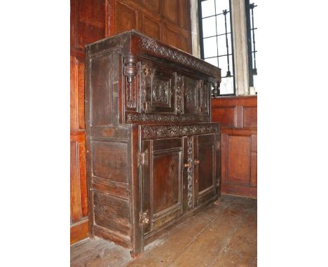 A small Charles I oak court cupboard, West Country, probably Dorset, circa 1630

With typical thin top boards, leafy-lunette 