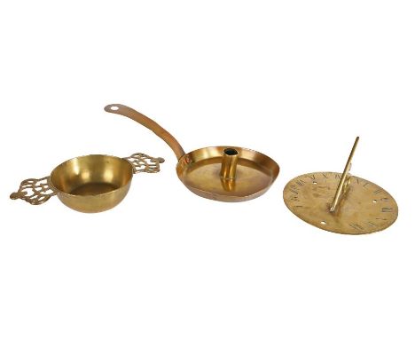 An early 18th century brass chamberstick, English, circa 1700

The sheet-brass pan with tapering straight sides, cylindrical 