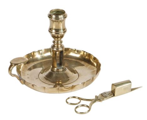 A rare George II Paktong 'strawberry dish' chamberstick, with candle-snuffer, circa 1740The socket with moulded rim atop a sl