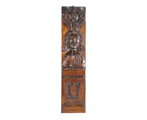 A Charles I oak figural term, circa 1640Carved with a male bust, with long hair, moustache, and one arm folded beneath a sash