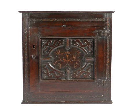 A Charles II oak and inlaid mural cupboard, Yorkshire/Lancashire, circa 1675

Having a rectangular moulded top, the frieze ce