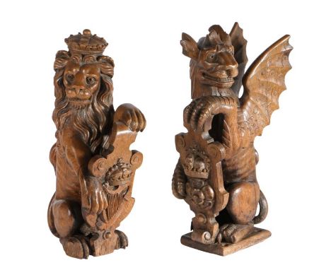 A pair of 19th century carved oak newel post finials, EnglishDesigned as supporters of Henry VIII's coat of arms, a lion guar