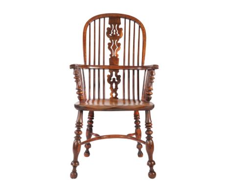 A Victorian yew high-back Windsor armchair, North East Yorkshire, circa 1840-70The hooped back with a burr shaped and pierced