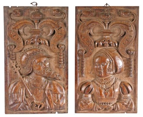 A fine pair of Henry VIII oak figural panels, English, circa 1530One male, wearing a helmet, shirt with standing collar, and 