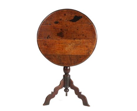                         A William & Mary oak tripod table, circa 1700,                        The circular top with ovolo-mou