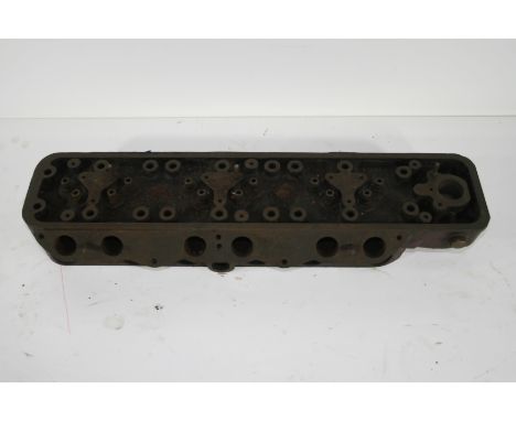 An MG cylinder head for a 6 cylinder car,cast CY MG 489103 and 87350C, used, together with a front  apron and undertray made 
