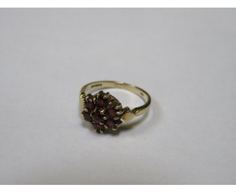 9ct GOLD LADIES DRESS RING SET WITH RUBY COLOURED STONES 